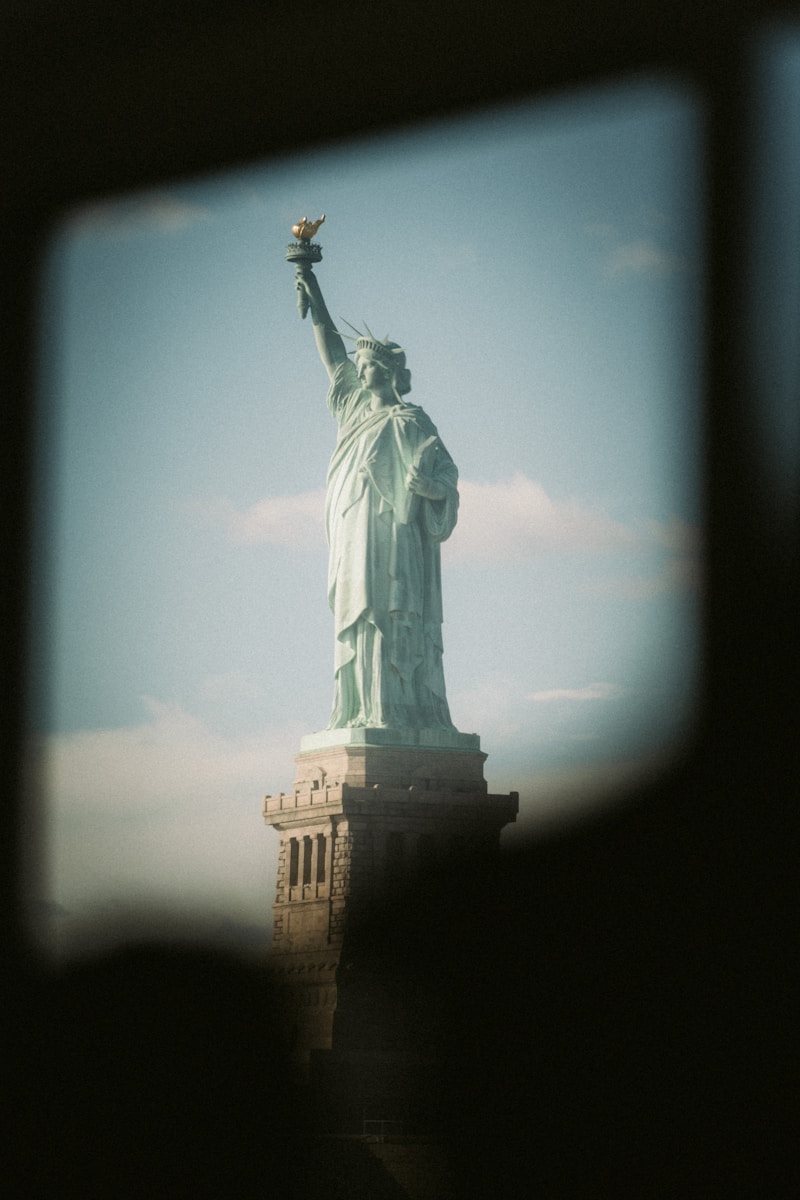 A view of the statue of liberty from a vehicle